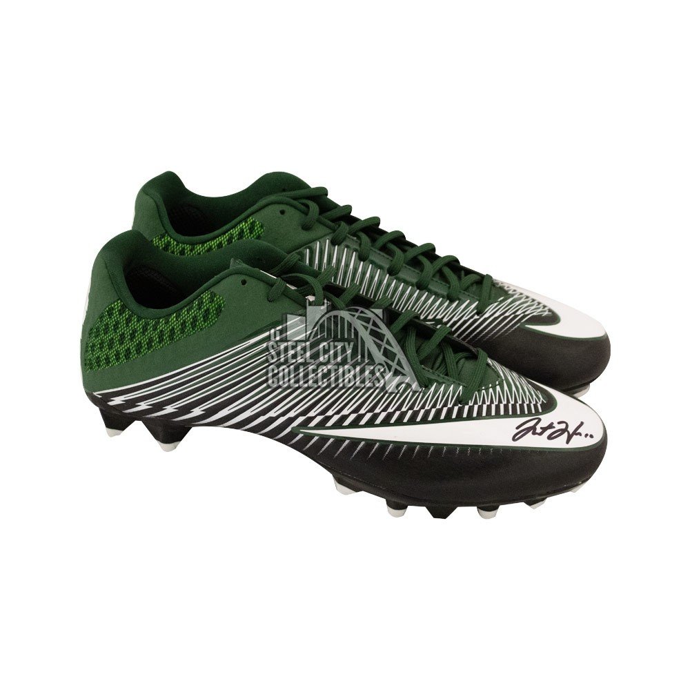 green and white nike football cleats