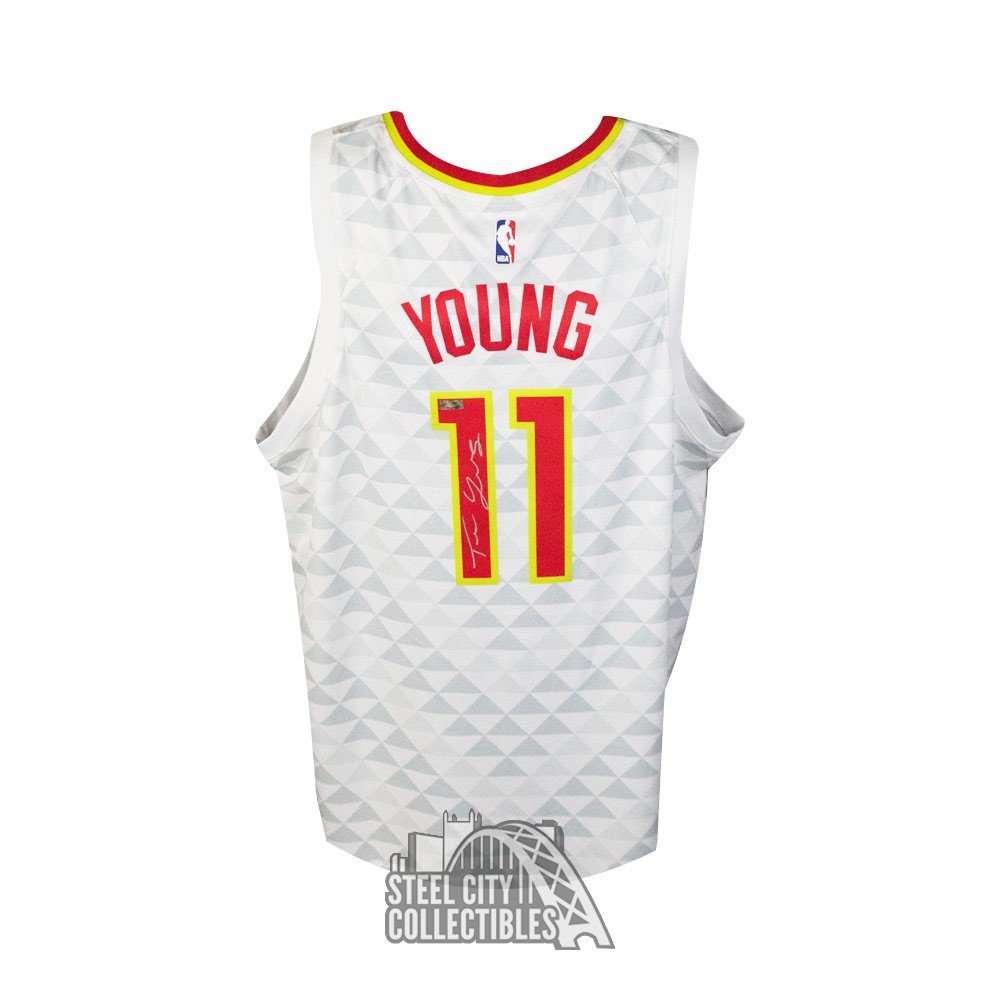 trae young white and gold jersey